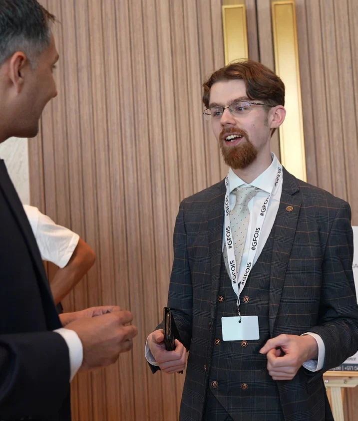 Reece sharing a conversation at an event
